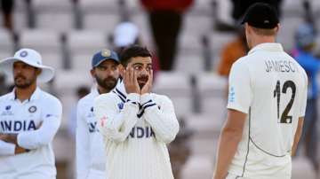 Virat Kohli of India talks to Kyle Jamieson after the Reserve Day of the ICC World Test Championship Final between India and New Zealand at The Hampshire Bowl on June 23