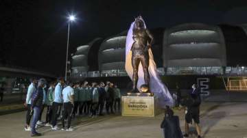 Argentina soccer players attend the unveiling of a Diego Maradona statue outside Madre de Ciudades stadium before their qualifying soccer match for the FIFA World Cup Qatar 2022 against Chile in Santiago del Estero, Argentina, Thursday, June 3