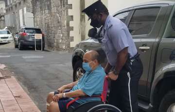 Mehul Choksi is taken in a wheelchair to the Magistrates court by police after his arrest for illegal entry into the country, in Roseau, Dominica, Wednesday, June 2
?