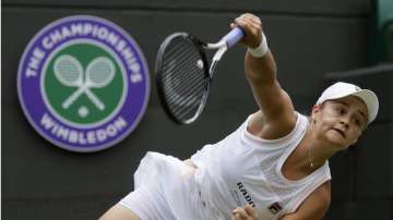 Australia's Ashleigh Barty serves to China's Saisai Zheng in their women's singles match during day two of the Wimbledon Tennis Championships in London, in this Tuesday, July 2