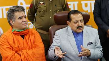 Minister of State, PMO, Jitendra Singh along with party's J&K chief Ravinder Raina (Left) addresses a press conference.