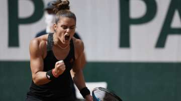 Maria Sakkari of Greece celebrates after winning a point against United States's Sofia Kenin during their fourth round match on day 9, of the French Open tennis tournament at Roland Garros in Paris, France, Monday, June 7