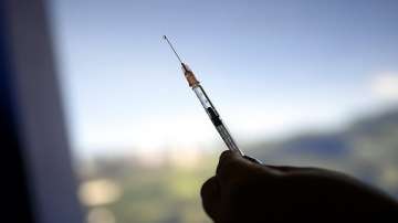 A healthcare worker prepares a dose of the Sputnik V vaccine for COVID-19.