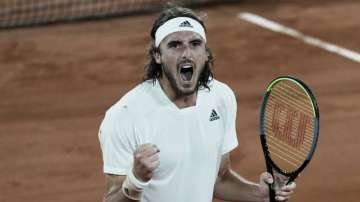 Stefanos Tsitsipas of Greece celebrates after defeating Russia's Daniil Medvedev during their quarterfinal match of the French Open tennis tournament at the Roland Garros stadium Tuesday, June 8