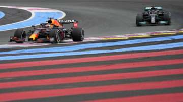 Red Bull driver Max Verstappen, left, leads next to Mercedes driver Lewis Hamilton of Britain during the French Formula One Grand Prix at the Paul Ricard racetrack in Le Castellet, southern France, Sunday, June 20