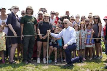 President Joe Biden poses for a photo after touring King Orchards fruit farm Saturday, July 3, 2021, in Central Lake, Mich. 
 