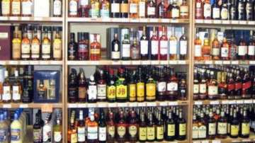 Rats empty wine from 12 closed bottles kept in liquor outlet