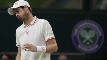 Britain's Andy Murray reacts after losing a point Canada's Denis Shapovalov during the men's singles third round match against on day five of the Wimbledon Tennis Championships in London, Friday July 2
