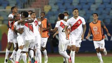Peru's players celebrate defeating Paraguay 4-3 in a penalty shootout during a Copa America quarterfinal soccer match at the Olimpico stadium in Goiania, Brazil, Friday, July 2