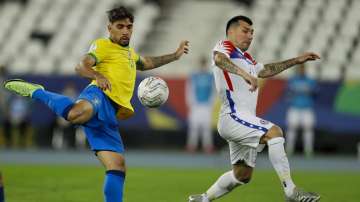 Brazil's Lucas Paqueta shots to score the opening goal during a Copa America quarterfinal soccer match against Chile at the Nilton Santos stadium in Rio de Janeiro, Brazil, Friday, July 2