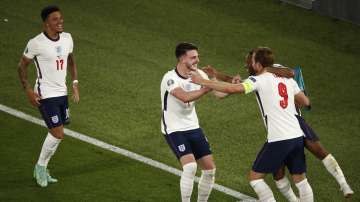 England's Harry Kane, right, celebrates after scoring his side's third goal during the Euro 2020 soccer championship quarterfinal match between Ukraine and England at the Olympic stadium in Rome, Italy, Saturday, July 3