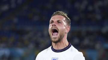 England's Jordan Henderson celebrates after scoring his side's fourth goal during the Euro 2020 soccer championship quarterfinal match between Ukraine and England at the Olympic stadium in Rome, Saturday, July 3