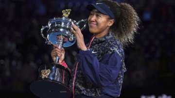 Japan's Naomi Osaka holds the Daphne Akhurst Memorial Cup after defeating United States Jennifer Brady in the women's singles final at the Australian Open tennis championship in Melbourne, Australia, in this Saturday, Feb. 20, 2021