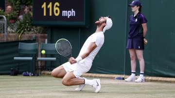 Sebastian Korda of the US plays a return during the men's singles fourth round match against Russia's Karen Khachanov on day seven of the Wimbledon Tennis Championships in London, Monday, July 5