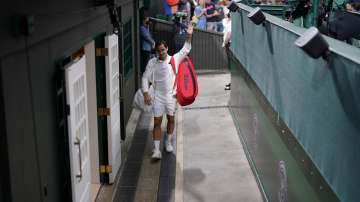 Switzerland's Roger Federer leaves Centre Court after defeating Italy's Lorenzo Sonego during the men's singles fourth round match on day seven of the Wimbledon Tennis Championships in London, Monday, July 5