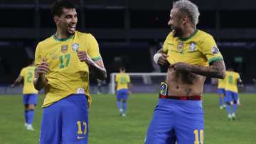 Brazil's Lucas Paqueta, left, celebrates with teammate Neymar after scoring his side's opening goal against Peru during a Copa America semifinal soccer match at Nilton Santos stadium in Rio de Janeiro, Brazil, Monday, July 5