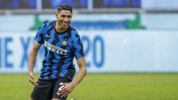 In this Sunday, Jan. 3, 2021 file photo, Inter Milan's Achraf Hakimi celebrates after he scored his side's sixth goal during the Serie A soccer match between Inter Milan and Crotone at the San Siro Stadium in Milan, Italy