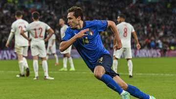 Italy's Federico Chiesa celebrates after scoring the opening goal during the Euro 2020 soccer championship semifinal match between Italy and Spain at Wembley stadium in London, England, Tuesday, July 6