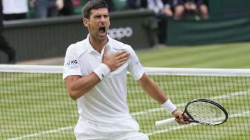 Serbia's Novak Djokovic celebrates after defeating Canada's Denis Shapovalov during the men's singles semifinals match on day eleven of the Wimbledon Tennis Championships in London, Friday, July 9