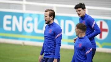 England's Harry Kane, left, Kieran Trippier and Harry Maguire, right, arrive for a training session at St George's Park, Burton upon Trent, England, Saturday July 10, 2021, ahead of their Euro 2020 soccer championship final match against Italy at Wembley Stadium on Sunday