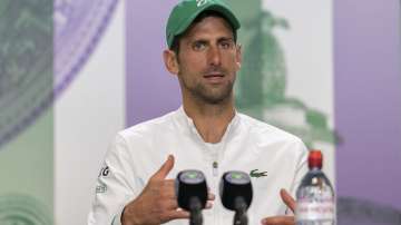 Novak Djokovic attends a press conference after winning the men's final against Italy's Matteo Berrettini at the Wimbledon Tennis Championships in London, Sunday, July 11