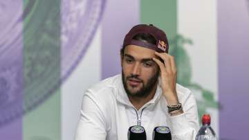 Italy's Matteo Berrettini attends a press conference after being defeated by Serbia's Novak Djokovic in the men's final against at the Wimbledon Tennis Championships in London, Sunday, July 11