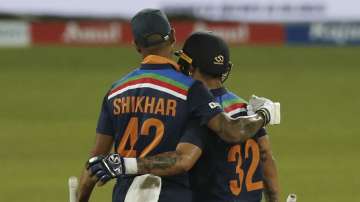 India's Ishan Kishan, right, celebrates scoring a half century with Shikhar Dhawan during the first one day international cricket match between Sri Lanka and India in Colombo, Sri Lanka, Sunday, July 18