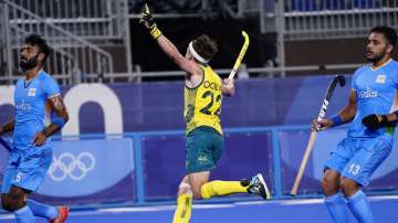 Australia's Flynn Andrew Ogilvie (22) reacts to his goal on India goalkeeper Sreejesh Parattu Raveendran during a men's field hockey match at the 2020 Summer Olympics, Sunday, July 25, 2021, in Tokyo