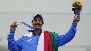 Bronze medalist Abdullah Alrashidi, of Kuwait, celebrates after the men's skeet at the Asaka Shooting Range in the 2020 Summer Olympics, Monday, July 26, 2021, in Tokyo, Japan