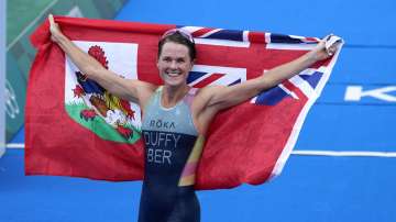 Gold medalist Flora Duffy of Bermuda celebrates after winning the women's individual triathlon competition at the 2020 Summer Olympics, Tuesday, July 27, 2021, in Tokyo, Japan