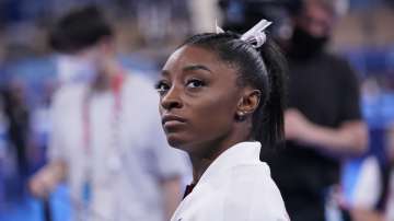 Simone Biles, of the United States, waits for her turn to perform during the artistic gymnastics women's final at the 2020 Summer Olympics, Tuesday, July 27
