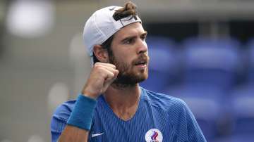 Karen Khachanov, of the Russian Olympic Committee, gestures during a semifinal men's tennis match against Pablo Carreno Busta, of Spain, at the 2020 Summer Olympics, Friday, July 30, 2021, in Tokyo