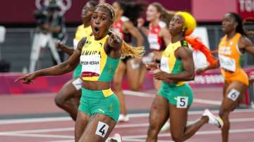  Elaine Thompson-Herah of Jamaica, celebrates as she wins the women's 100-meters final 