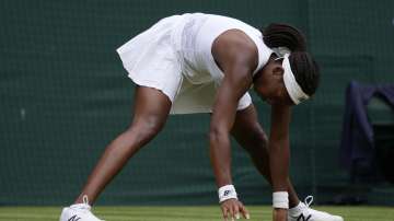 Coco Gauff of the U.S. slips during the women's singles fourth round match against Germany's Angelique Kerber on day seven of the Wimbledon Tennis Championships in London, Monday, July 5