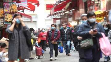 People wearing masks at a market in Hong Kong to prevent the spread of Coronavirus