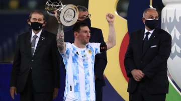 Lionel Messi of Argentina lifts his top scorer award after winning the final of Copa America Brazil 2021 between Brazil and Argentina at Maracana Stadium on July 10