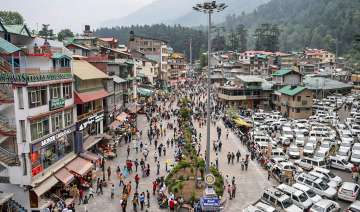 Tourists visit the Mall Road after relaxation in COVID-19 curfew in Manali on July 3