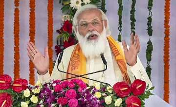 Prime Minister Narendra Modi addresses the gathering during inauguration of development projects in Varanasi