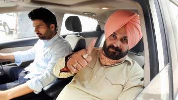 Congress leader Navjot Singh Sidhu leaves for Amritsar from his residence, in Patiala, Saturday, July 17.
 