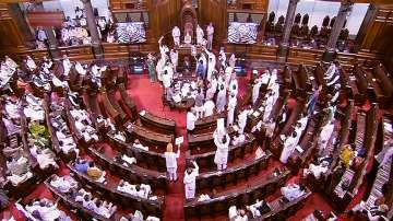 New Delhi: Members protest in the well of the Rajya Sabha during the Monsoon Session of Parliament, in New Delhi, Wednesday, July 28, 2021.