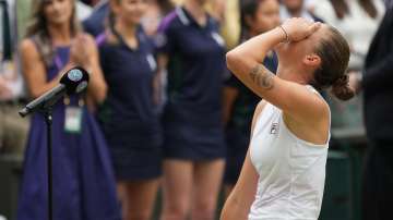 Czech Republic's Karolina Pliskova reacts after winning runners up during the presentation ceremony after her defeat bye Australia's Ashleigh Barty in the women's singles final on day twelve of the Wimbledon Tennis Championships in London, Saturday, July 10