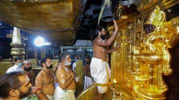 Priests perform rituals at Sabarimala Temple.