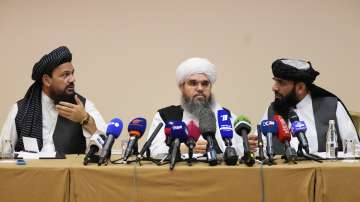 From left, Mohammad Naim, Mawlawi Shahabuddin Dilawar and Suhil Shaheen, members of a political delegation from the Afghan Taliban's movement, attend a news conference in Moscow, Russia, Friday, July 9, 2021.