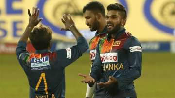 Sri Lanka's Wanindu Hasaranga, right, celebrates taking the wicket of Indias Devdutt Padikkal during the second Twenty20 cricket match between Sri Lanka and India in Colombo, Sri Lanka, Wednesday, July 28