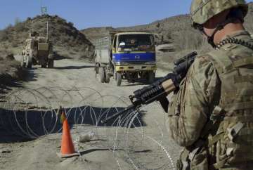 FILE - In this Dec. 1, 2011, file photo, a U.S. soldier with Apache Company of Task Force 3-66 Armor, out of Grafenwoehr, Germany, stands guard at a police checkpoint at Gulruddin pass in Sar Hawza district of Paktika province, south of Kabul, Afghanistan. A significant majority of Americans are skeptical that the war in Afghanistan was worthwhile even as they are more divided over the president's handling of foreign policy and national security, according to a new poll from The Associated Press-NORC Center for Public Affairs Research.
?