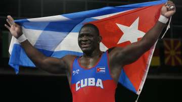 Cuba's Mijain Lopez Nunez celebrates defeating Georgia's Lakobi Kajaia during the men's 130kg Greco-Roman wrestling final match at the 2020 Summer Olympics, Monday, Aug. 2