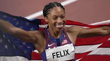 Allyson Felix, of United States smiles after taking the bronze, in the final of women's 400-meters at the 2020 Summer Olympics, Friday, Aug. 6, 2021, in Tokyo