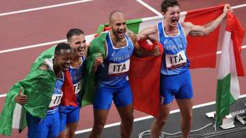 From right: Filippo Tortu, Lamont Jacobs Lorenzo Patta and Eseosa Desalu of Italy celebrate after taking the gold medal in the final of the men's 4 x 100-meter relay at the 2020 Summer Olympics, Friday, Aug. 6