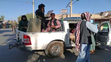 Taliban fighters patrol inside the city of Farah, capital of Farah province southwest of Kabul, Afghanistan.