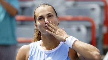 Aryna Sabalenka of Belarus blows kisses to the crowd after beating her compatriot Victoria Azarenka during quarterfinal play at the women's National Bank Open tennis tournament in Montreal, Friday, Aug. 13